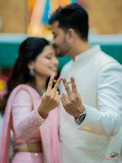 A fun and creative way to show off the engagement rings. Cheryl and Edwin's playful pose adds a touch of personality to their engagement album.