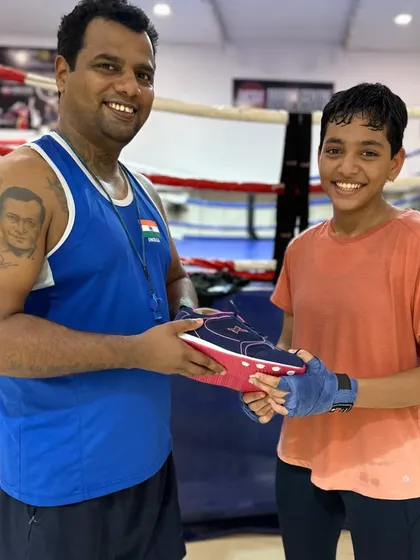 A smile of appreciation. Gifting shoes to our boxer Vedika is a small gesture to encourage her to keep pushing her limits.