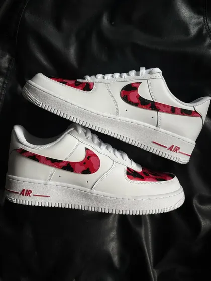 A custom Nike Air Force 1 with a red and black camouflage pattern.