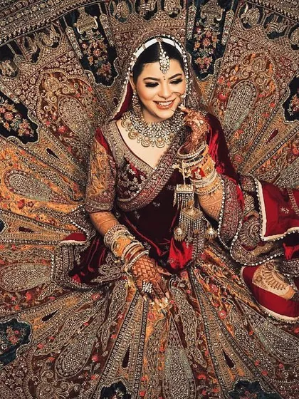 A bridal portrait showcasing the magnificent detail and spread of a velvet lehenga. I use creative angles and lighting to turn your bridal attire into a work of art, capturing its full grandeur.