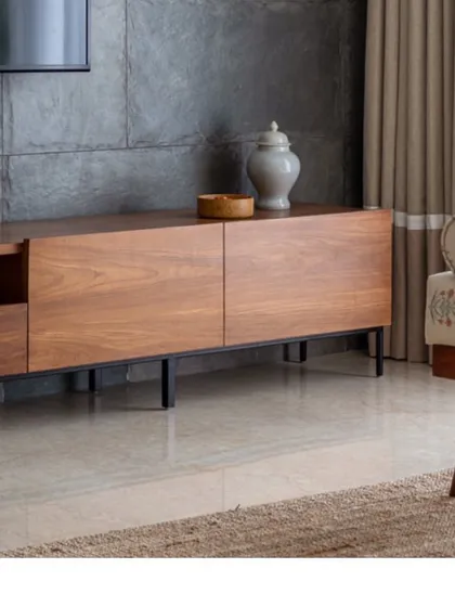 A close-up of the warm wood grain on a media console. We love using natural materials to bring warmth and organic texture into the homes we design.