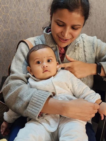 A close-up of the mother and baby, radiating peace and contentment. This is the result of dedicated prenatal yoga practice, which supports both the physical and emotional well-being of mother and child.