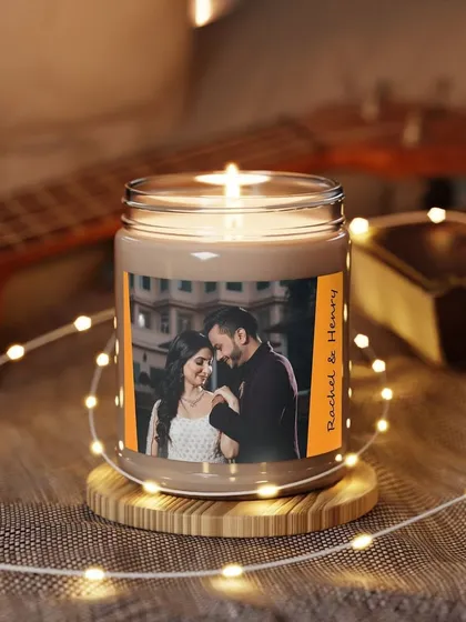 Imagine gifting this! A beautifully lit scented candle featuring a photo of the happy couple. It's a romantic and personal gift idea for weddings or anniversaries.