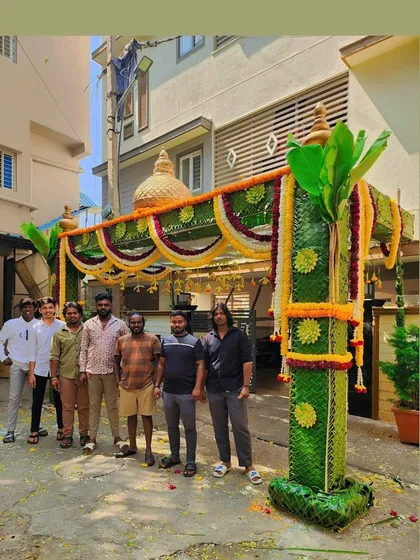 My team and I standing proudly in front of a completed *chappara*. It's a joy to see our hard work come to life and create a beautiful entrance for our clients.