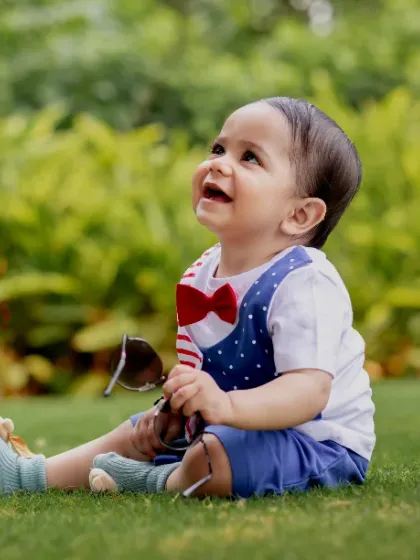 Pure joy, tiny toes, and endless giggles. A candid moment of happiness in the sun.