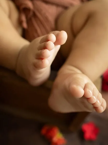 Tiny toes peeking out. This detail shot, taken during a themed session, adds another layer of storytelling to the collection.