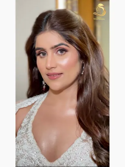 A close-up of the soft curls and glowing makeup, a perfect combination for any pre-wedding event.