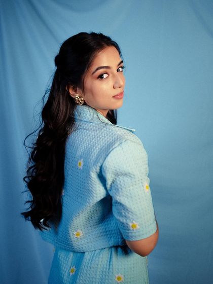 A classic portrait of Ahsaas Channa in the daisy-embroidered co-ord set, looking back over her shoulder.