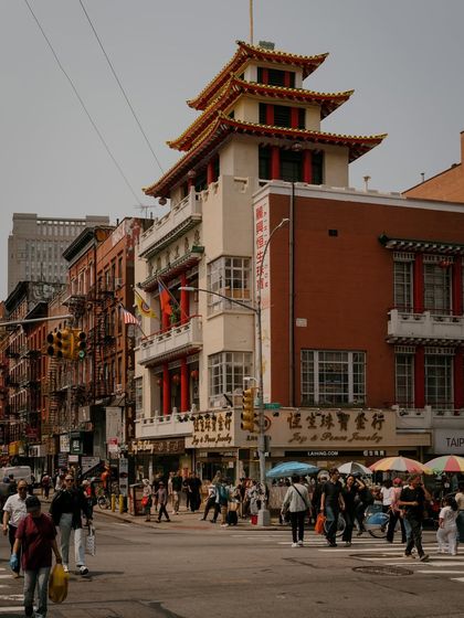 The iconic pagoda-style roof of a building on the corner of Canal and Mott Street in Chinatown. It's a landmark that represents the unique character of the area.