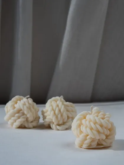 Unwind with our knot candles. Their intricate, braided design adds a cozy and textural element to your decor.