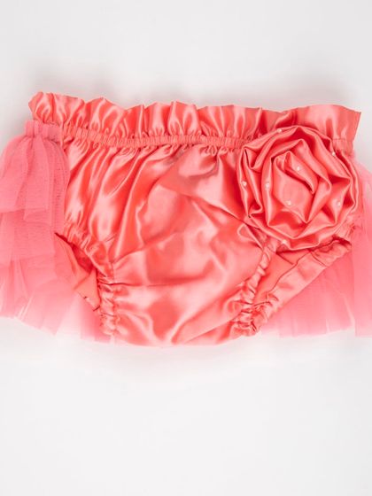 The back view of the coral satin diaper cover with a large rose.