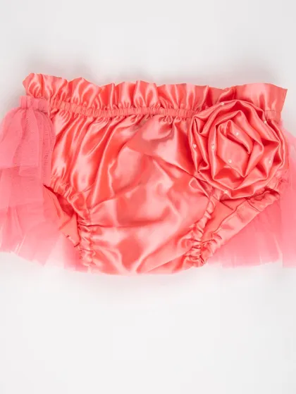 The back view of the coral satin diaper cover with a large rose.