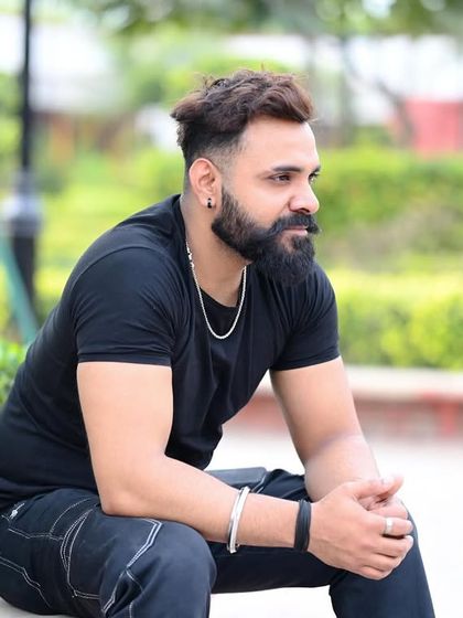 A relaxed, seated outdoor portrait. This showcases a casual and approachable look, perfect for lifestyle brands.