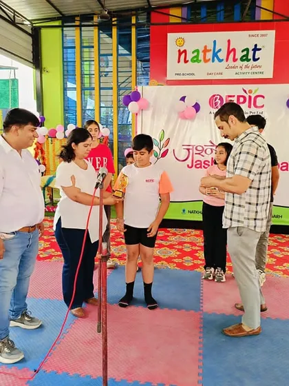 A proud moment at the summer camp finale as a student receives an award for the drawing competition. I believe in encouraging and rewarding creativity in all its forms.