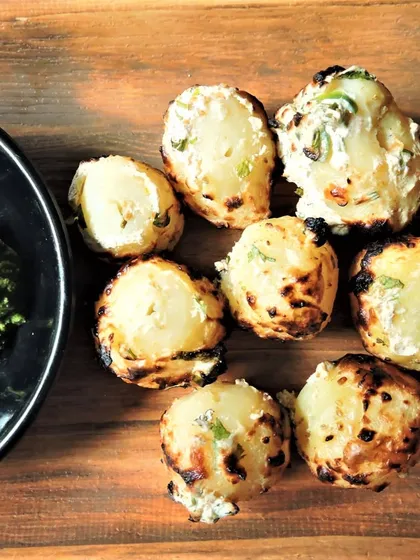 Simple yet delicious, these tandoori potatoes are marinated in a creamy and spiced mixture and roasted until they have a beautiful char. Served with a fresh green chutney for dipping.