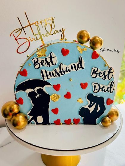 The most trending design. A fault-line cake celebrating the "Best Husband" and "Best Dad."