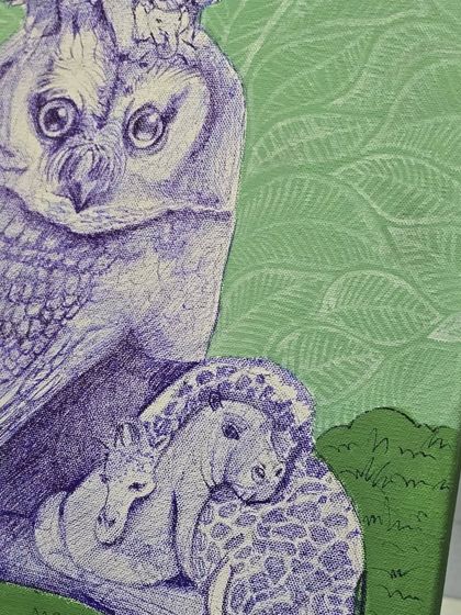 A close-up of the whimsical ballpoint pen drawing, showing an owl with smaller animals on its head, all rendered with impressive detail.