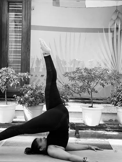 A black and white shot of the one-legged shoulder stand. Inversions are a wonderful part of yoga practice, helping to bring a new perspective both physically and mentally.