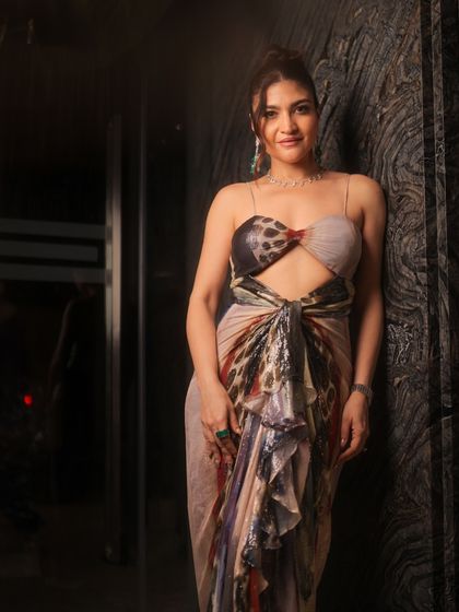 This full-length shot captures the modern and chic vibe of her outfit and makeup. It's a perfect example of effortless glam.