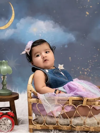 Ready for sweet dreams in a starry night sky. This cozy setup with a miniature bed and a celestial backdrop is perfect for a magical bedtime-themed photoshoot.