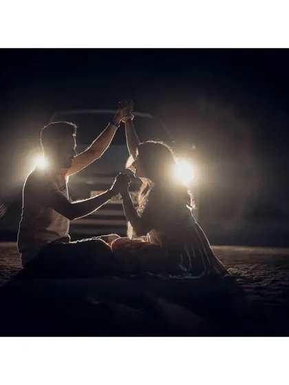 Getting creative after dark. This romantic silhouette shot uses car headlights to create a unique and memorable pre-wedding photograph.