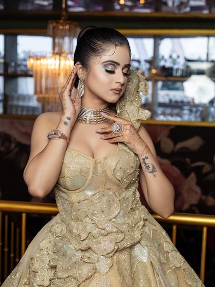 A beautiful gown look with wet-look hair and glittery eye makeup.