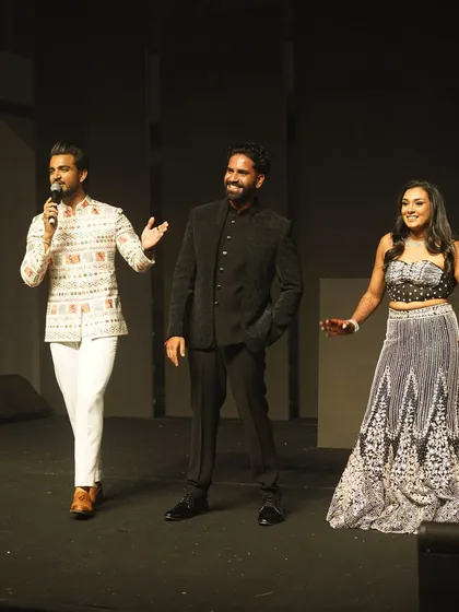 Interacting with the bride and groom on stage. I make sure the couple feels celebrated and at ease during their special night.