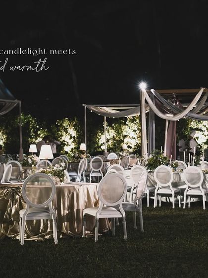A wide shot of the dinner party in Goa, with the text overlay "where candlelight meets curated warmth".