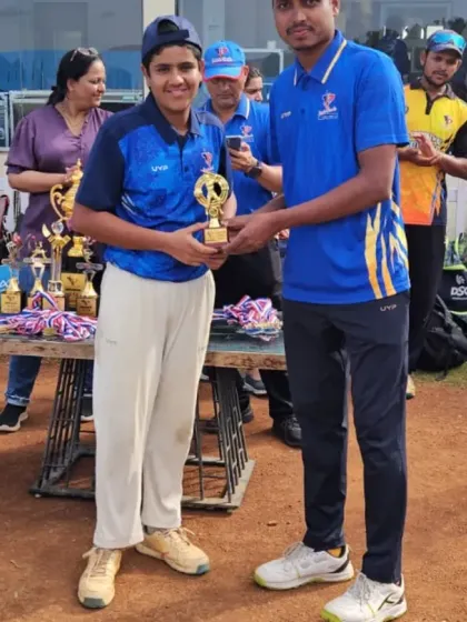Recognizing talent across the board, a player receives her award, highlighting our commitment to encouraging all young cricketers.