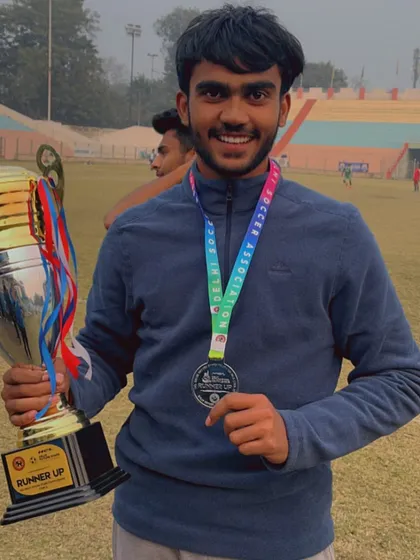Celebrating success with the team. A player proudly holds the runner-up trophy, a symbol of the hard work and dedication from our entire U19 squad.
