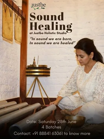 A poster from a past group sound healing event, capturing our core belief: "In sound we are born, In sound we are healed." Here, I am preparing the instruments for a session, ready to guide participants toward inner calm.