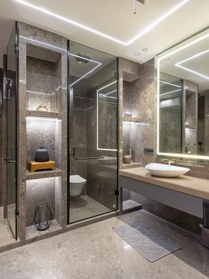 Another angle of the same bathroom, highlighting the spacious layout and the clean lines of the custom joinery and glass partitions.