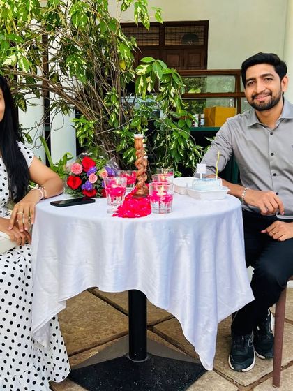 A happy couple enjoying their special candlelight dinner, a perfect way to celebrate an anniversary or just each other.