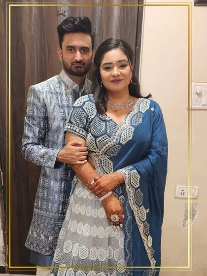 A closer look at the happy couple in their blue and silver coordinated attire. Renting designer wear for both him and her makes for perfect photos.