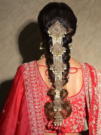 A full view of the heavily accessorized bridal braid. The combination of the twisted hair and the ornate jewelry is simply breathtaking.