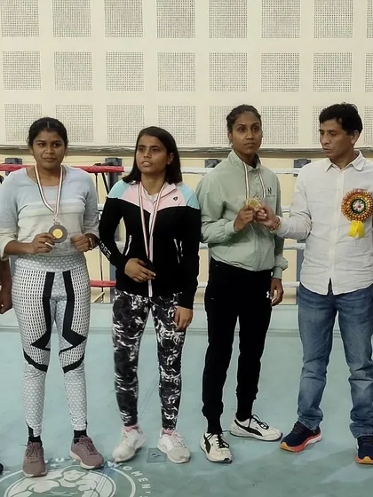 Our boxers on the podium during the medal ceremony at the Delhi State Boxing Championship. Seeing them recognized for their hard work is the ultimate goal of our academy.