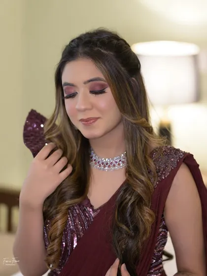 A close-up of the cocktail glam. The maroon eyeshadow is blended beautifully, and the nude lip balances the look perfectly.