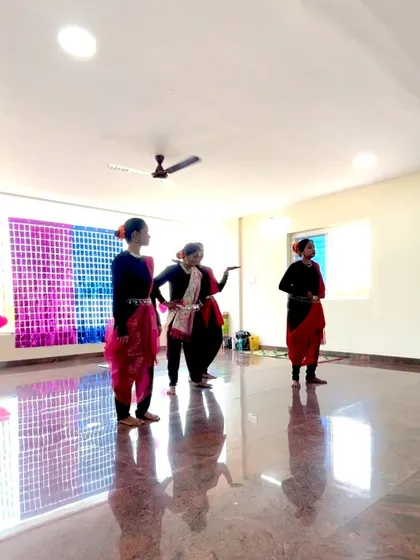 The performers in the middle of their routine for Women's Day, showcasing their grace and coordination.