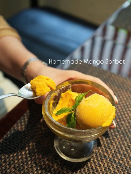 Our homemade Mango Sorbet, a light and refreshing dessert. We make it in-house with fresh, seasonal mangoes for a pure and intense fruit flavor.