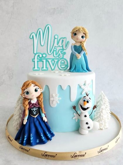 The Frozen theme is still a favourite for so many kids. This cake features a snowy drip effect and is decorated with beautiful, handcrafted figurines of Anna, Elsa, and Olaf.