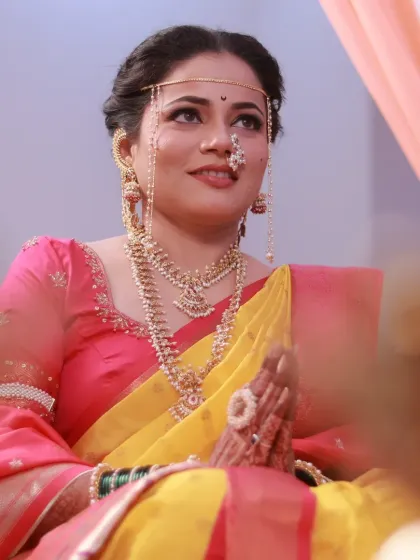 The bride during her wedding ceremony, looking serene and beautiful.