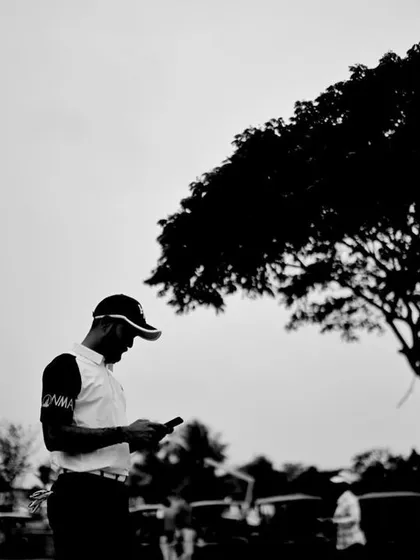 A candid, focused moment between shots. My coaching helps you stay present and centered, managing the mental challenges of the game as effectively as the physical ones.