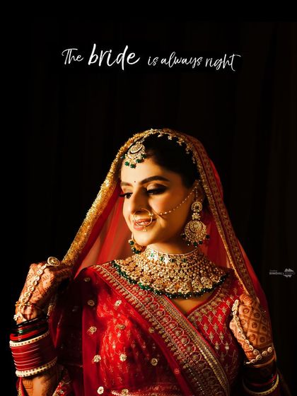 "The bride is always right." A beautiful, classic portrait of the bride in her red lehenga, with a playful and confident caption.