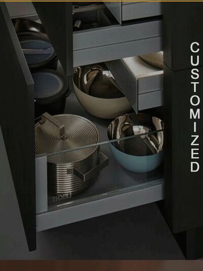We offer fully customized drawers to fit your specific needs. This deep drawer is designed to hold large pots, pans, and bowls, featuring smooth-gliding hardware that can handle heavy loads.
