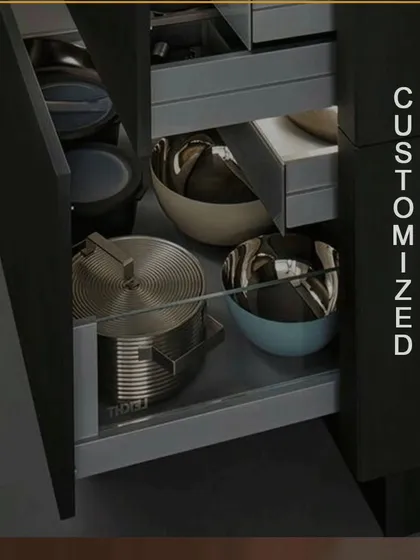 We offer fully customized drawers to fit your specific needs. This deep drawer is designed to hold large pots, pans, and bowls, featuring smooth-gliding hardware that can handle heavy loads.