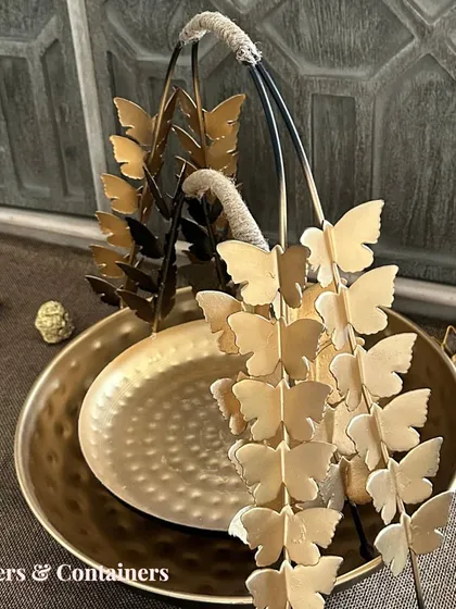 A close-up of the butterfly-handled basket, a versatile piece for both serving and decor.