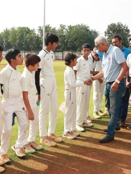 Mr. Dravid interacting with the young players of the U-12 teams, offering them encouragement.