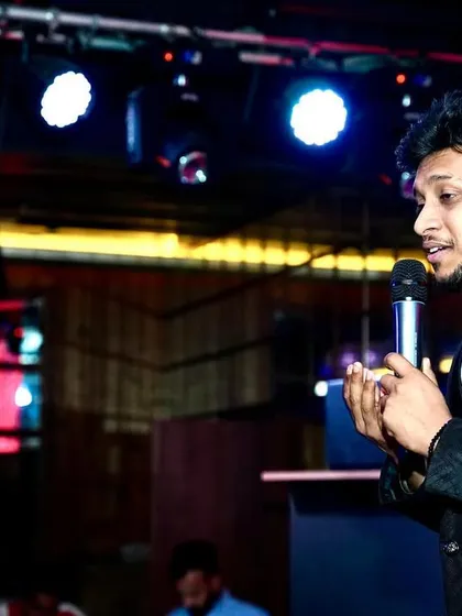 Speaking to the audience between songs. Building a rapport with the crowd is a key part of my performance, making everyone feel like they are part of the show.