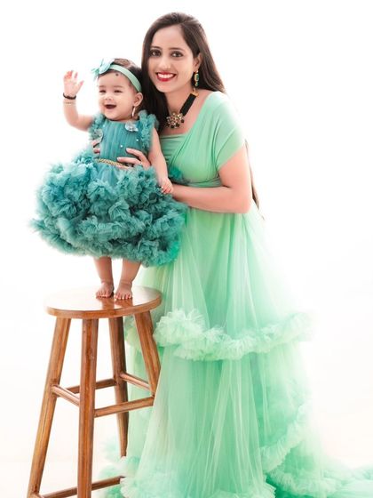 A mother and daughter duo in stunning matching green gowns. This is a perfect example of the luxury styling I offer for my sessions.