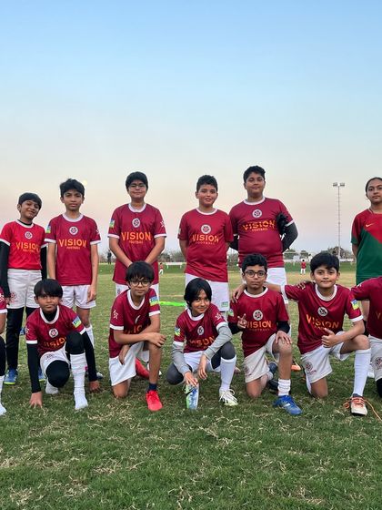 A team photo celebrating one year of coaching at the academy. A journey of growth, passion, and unforgettable moments.